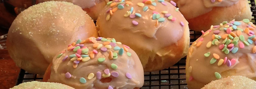 Easter Bread rolls with colored sugar and pastel egg-shaped sprinkles